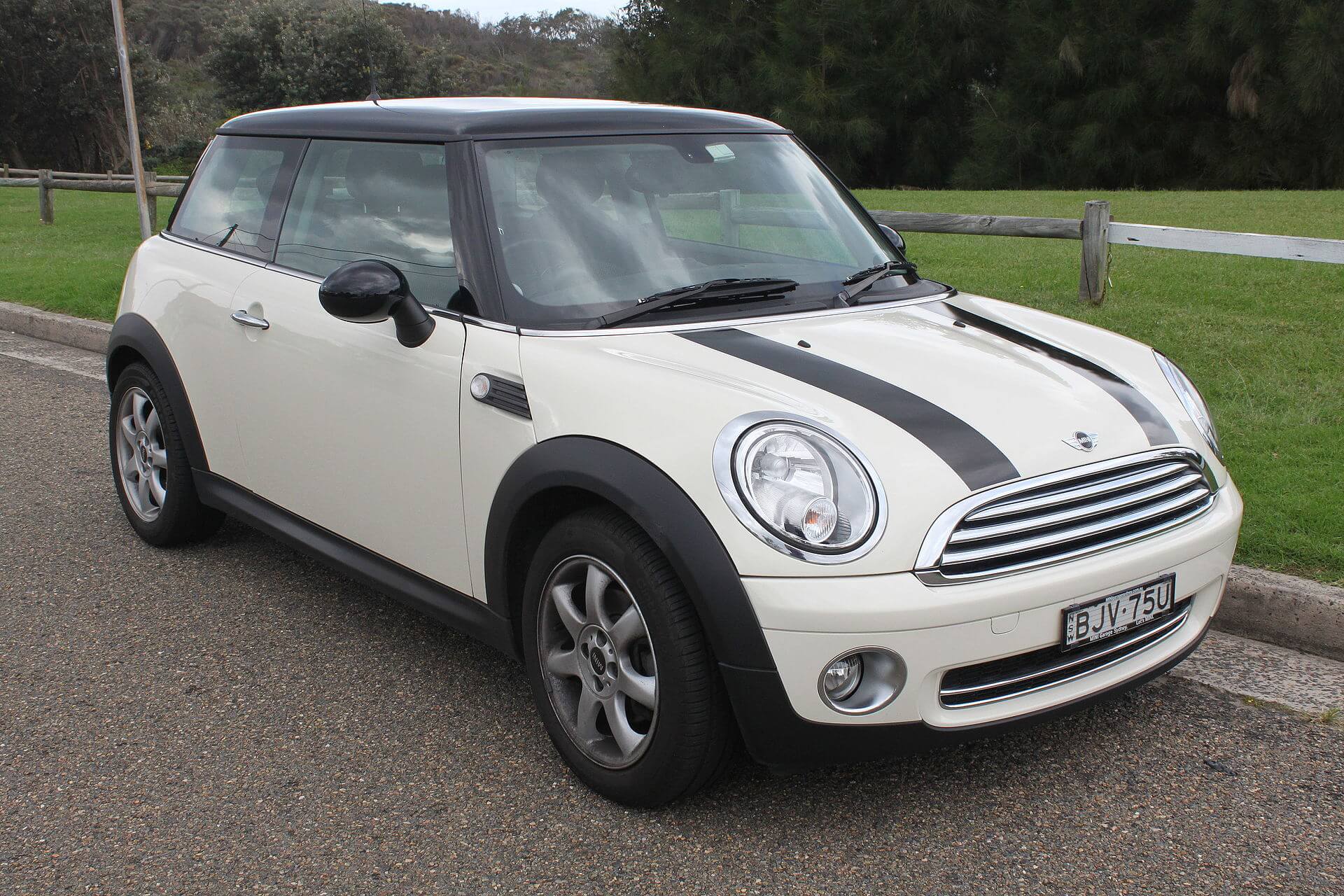 Photo showing a regular white Mini Cooper hatchback