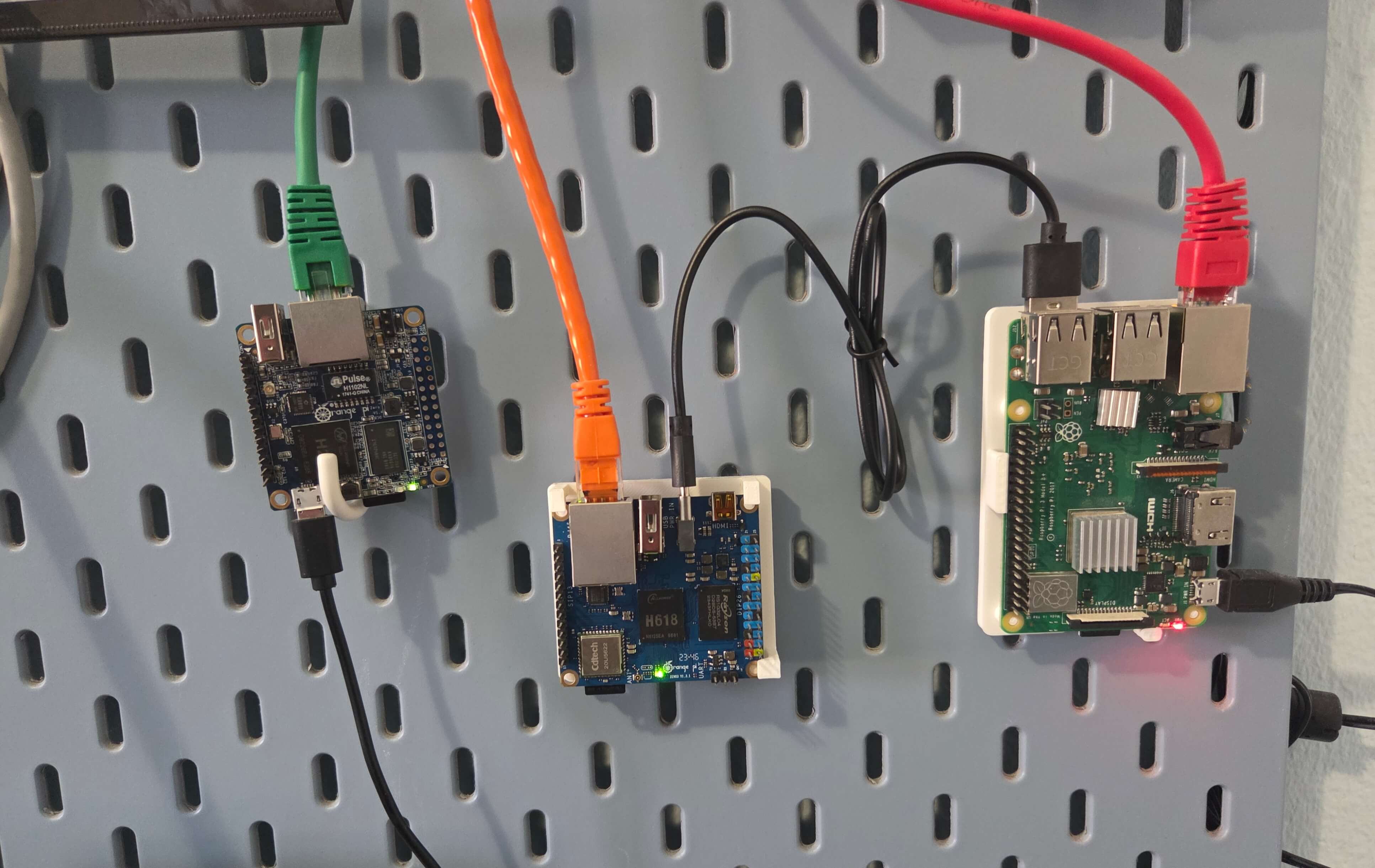 Image showing Orange Pi Zero 3 mounted on IKEA pegboard, alongside another Orange Pi and Raspberry Pi
