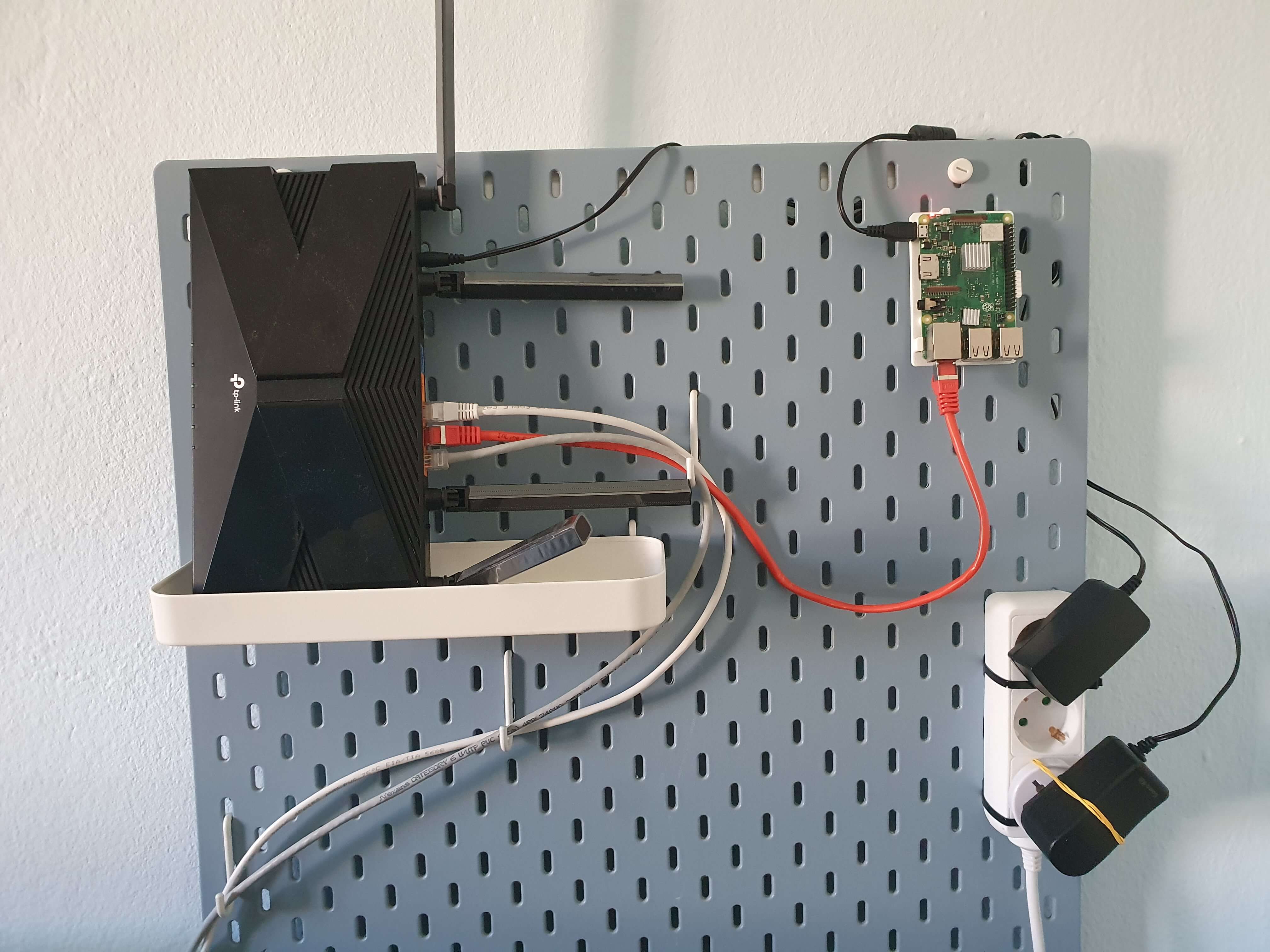 Image showing wall-mounted router and a Raspberry Pi